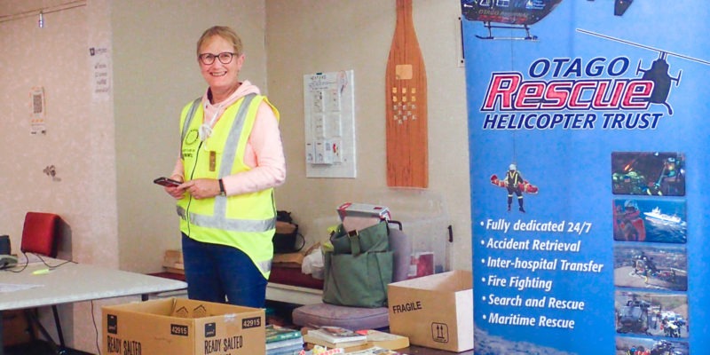 Rotarians flip books for Otago Rescue Helicopter Trust